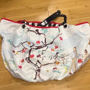 DSW large satin hobo bag with chain straps and park graphic